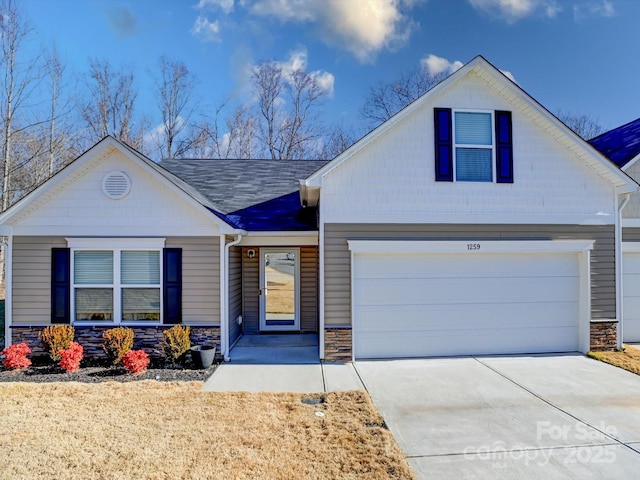 view of front of property with a garage