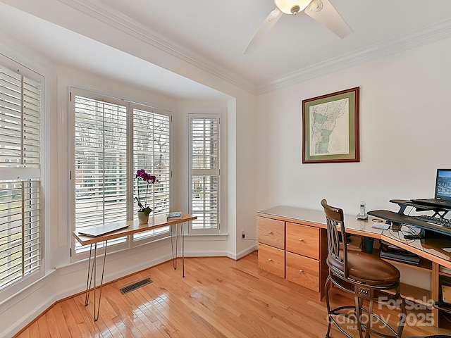 office space featuring ornamental molding, ceiling fan, and light wood-type flooring