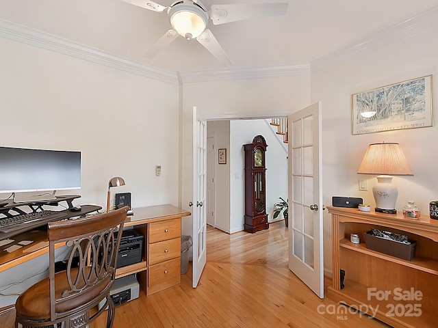 home office with ornamental molding, ceiling fan, light wood-type flooring, and french doors