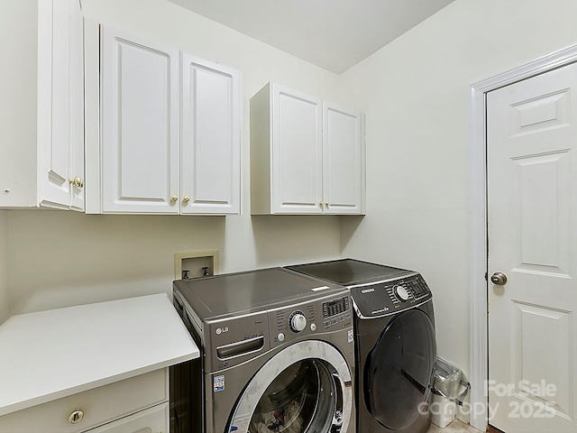 laundry area with cabinets and independent washer and dryer