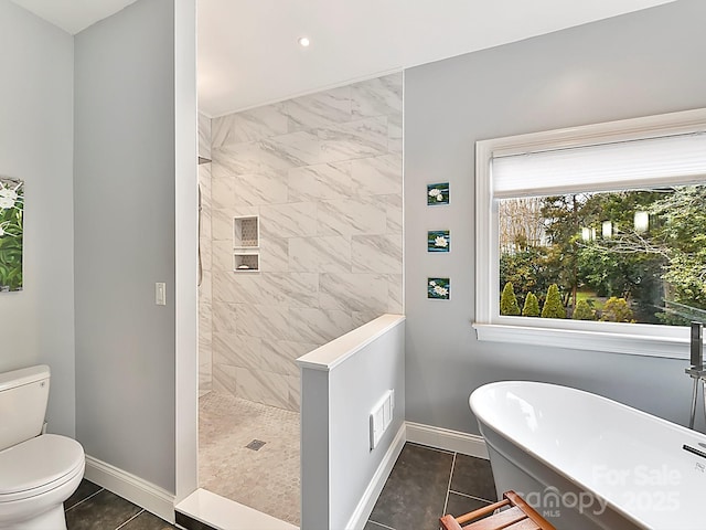 bathroom with tile patterned flooring, independent shower and bath, and toilet