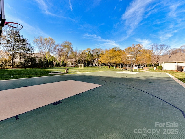 view of basketball court featuring a lawn