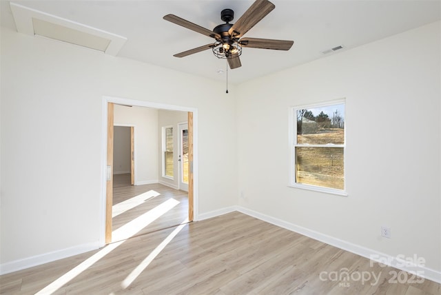 spare room with light hardwood / wood-style floors