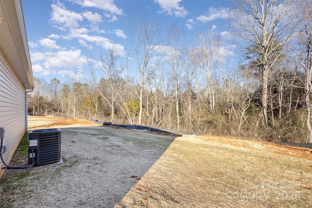 view of yard with central AC