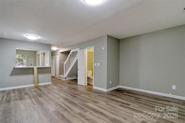 basement featuring hardwood / wood-style flooring