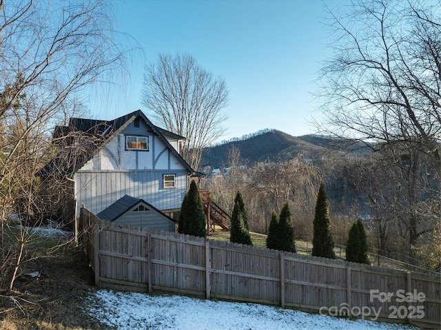 view of snowy exterior featuring a mountain view