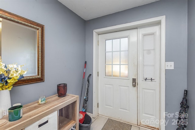 entryway featuring light tile patterned floors