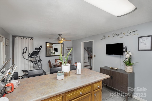 kitchen with light tile patterned flooring and ceiling fan