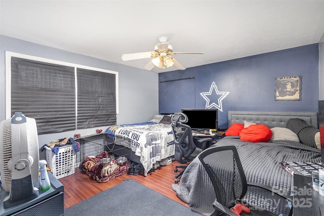 bedroom with wood-type flooring and ceiling fan