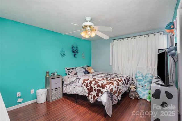 bedroom featuring dark hardwood / wood-style floors and ceiling fan