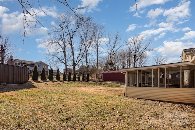 view of yard with a sunroom