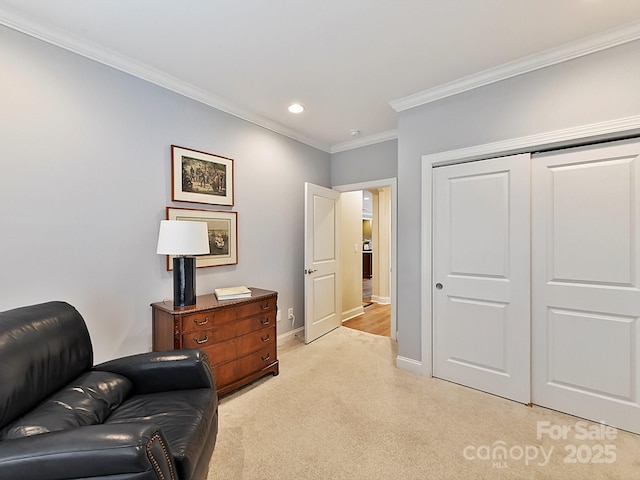 living area featuring crown molding and light colored carpet