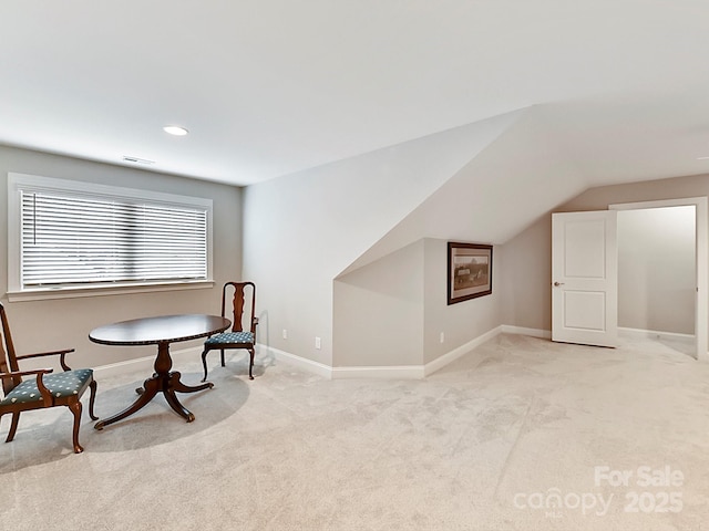 sitting room with light carpet and lofted ceiling