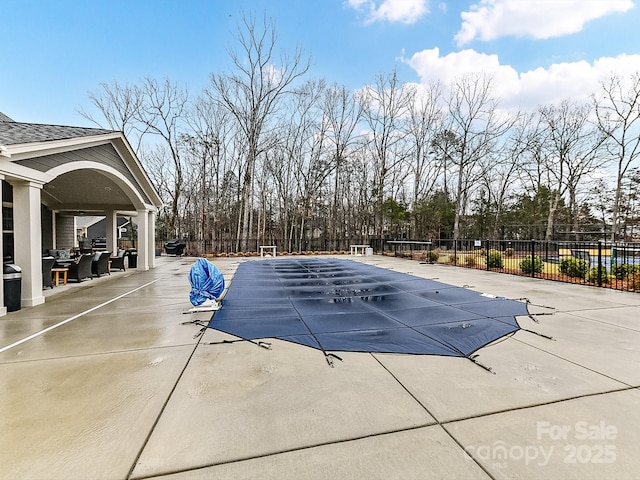 view of swimming pool featuring a patio