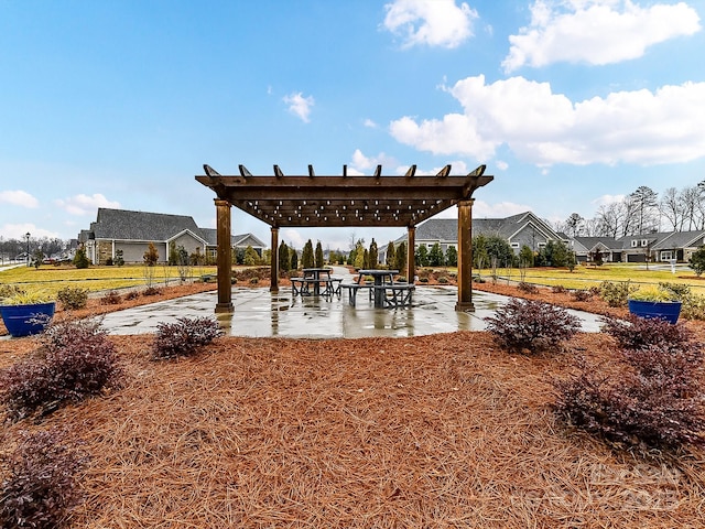 exterior space with a patio area and a pergola