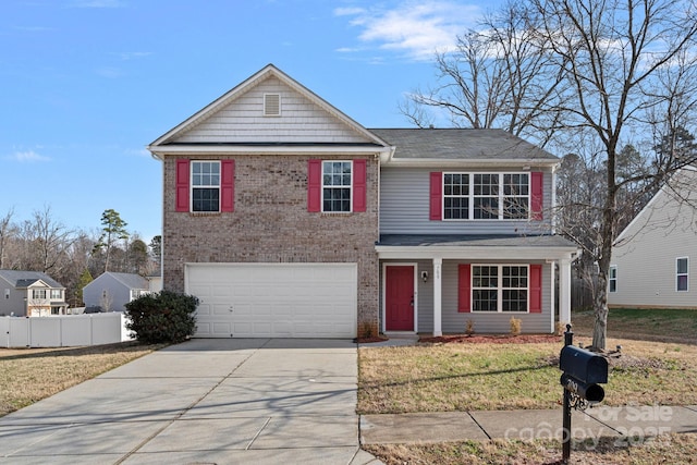 view of front property with a front yard and a garage