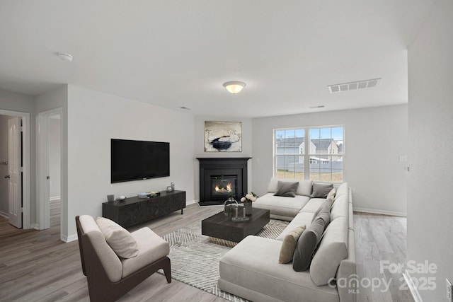 living room with light hardwood / wood-style flooring