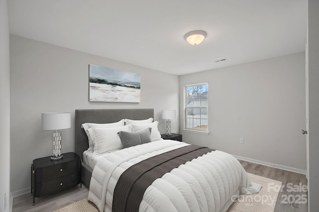 bedroom with light hardwood / wood-style flooring