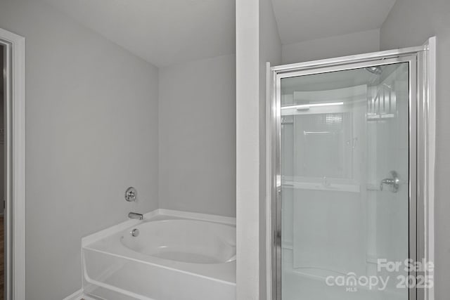 bathroom with shower with separate bathtub