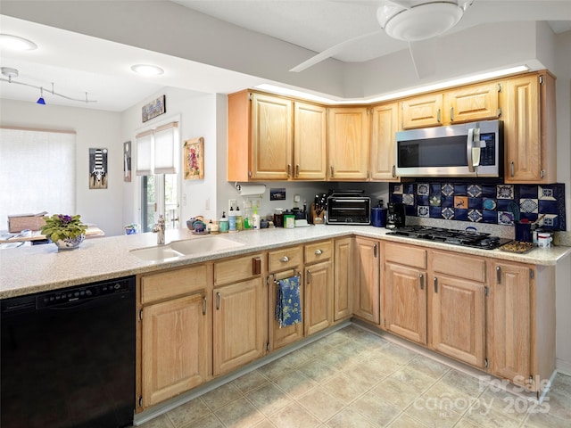 kitchen featuring sink, decorative backsplash, ceiling fan, and black appliances