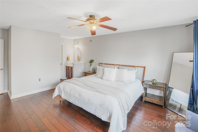 bedroom featuring ceiling fan and dark wood-type flooring