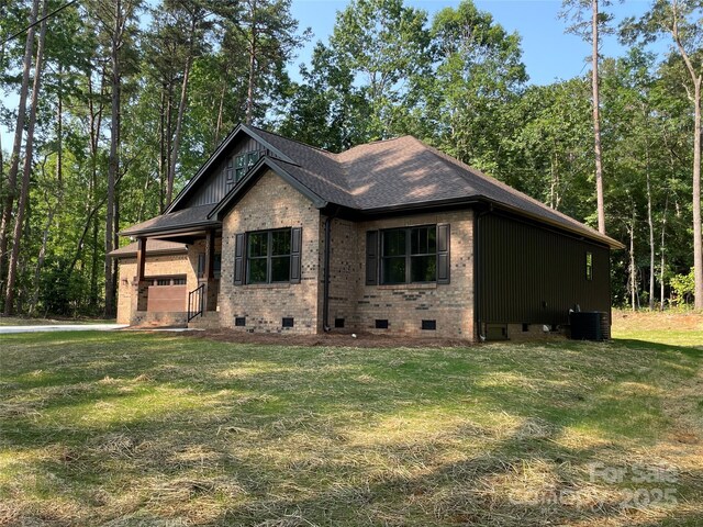 305 General As Johnston St, Stanley, NC 28164 - view of front of house with crawl space, cooling unit, a front lawn, and brick siding