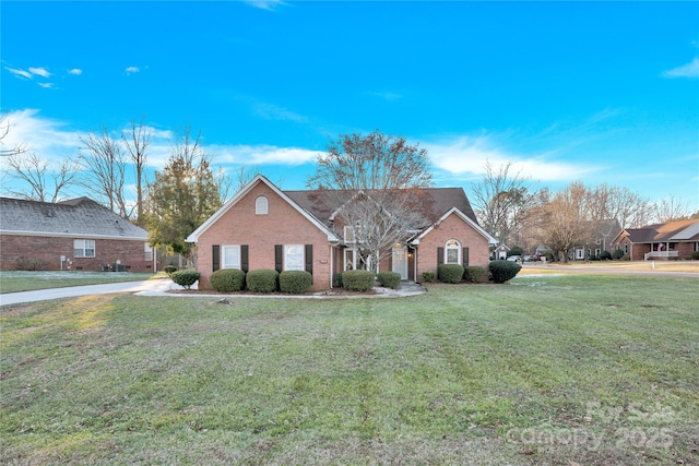 ranch-style home featuring a front yard