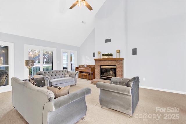 carpeted living room with a fireplace, high vaulted ceiling, and ceiling fan