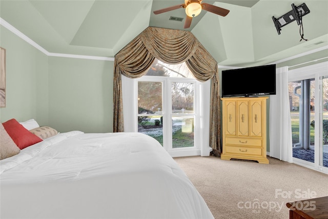 carpeted bedroom with access to outside, ceiling fan, and multiple windows