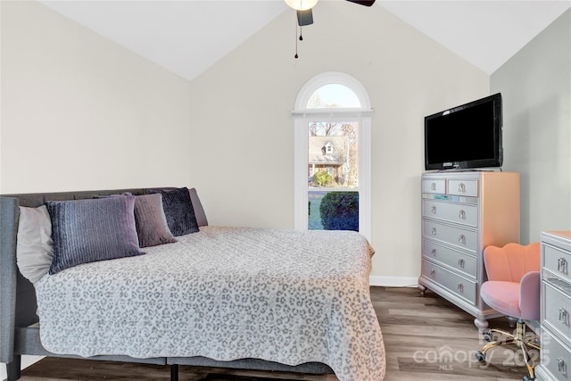 bedroom with lofted ceiling, ceiling fan, and wood-type flooring