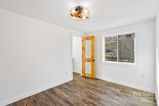 empty room with wood-type flooring