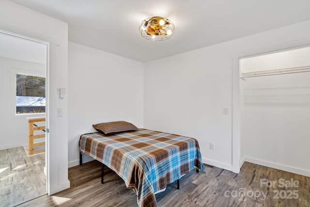 bedroom featuring a closet and hardwood / wood-style floors