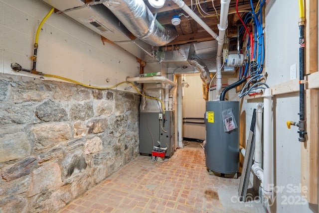 utility room featuring water heater and heating unit