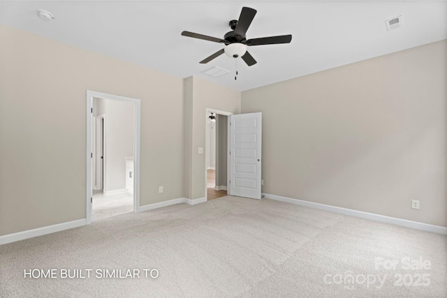 unfurnished bedroom with light carpet, visible vents, and baseboards