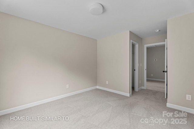 unfurnished bedroom with light carpet and baseboards