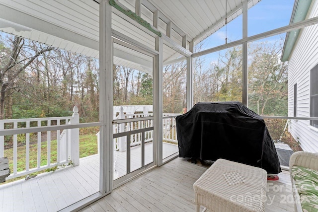 sunroom / solarium with lofted ceiling