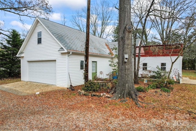 view of side of home with a garage