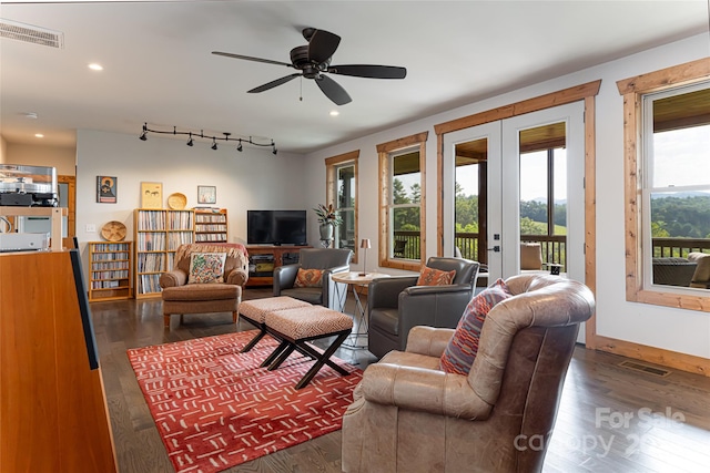 living room with dark wood-type flooring, recessed lighting, french doors, and visible vents