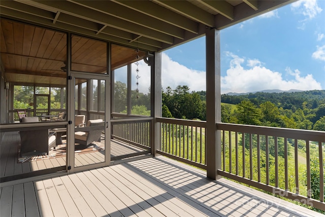 wooden terrace featuring a sunroom