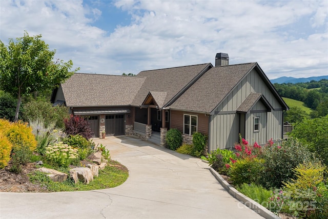 18 Gracie Ln, Weaverville, NC 28787 - craftsman inspired home featuring roof with shingles, a chimney, concrete driveway, stone siding, and a garage