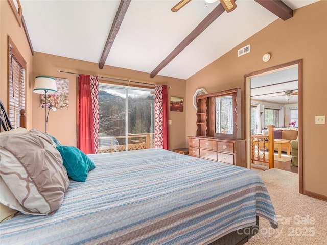 carpeted bedroom featuring lofted ceiling with beams and ceiling fan