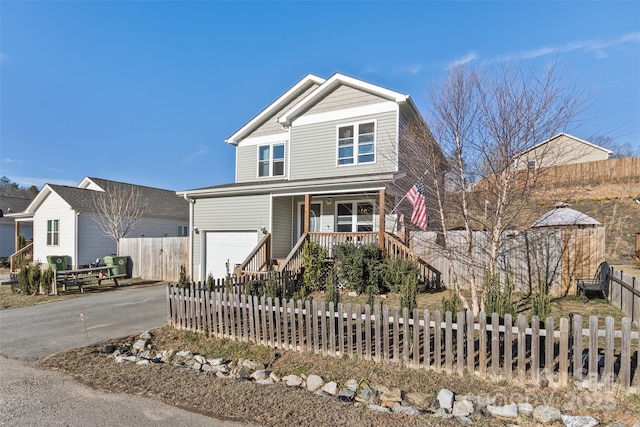 view of front of house featuring a porch and a garage