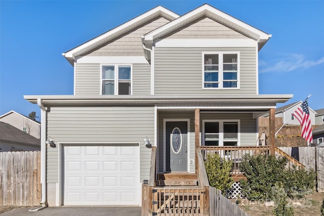 view of front of house featuring a garage and a porch