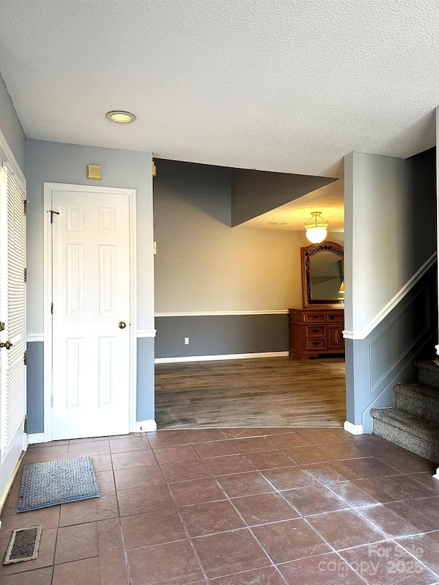 interior space featuring a textured ceiling