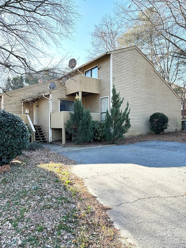 view of property exterior featuring a balcony