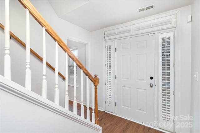 entrance foyer featuring dark hardwood / wood-style floors