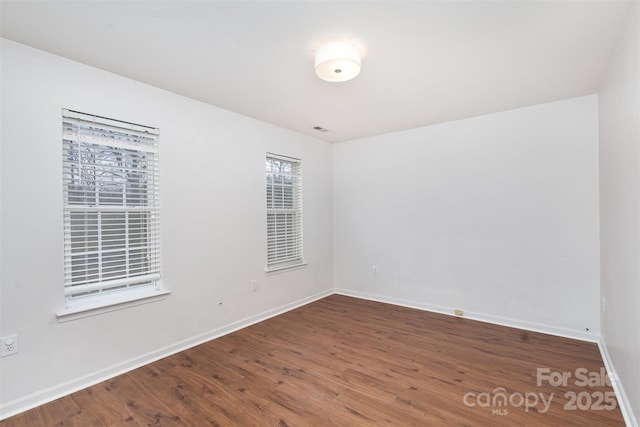 empty room with wood-type flooring