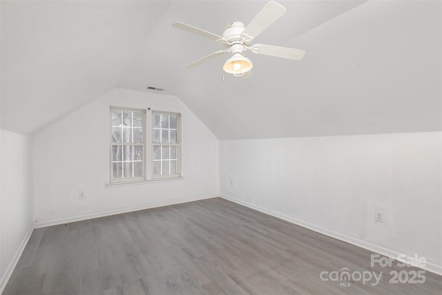 bonus room with hardwood / wood-style flooring, ceiling fan, and lofted ceiling