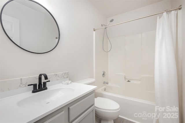 full bathroom featuring shower / tub combo, vanity, and toilet