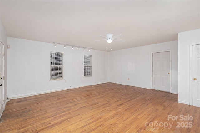 unfurnished room with ceiling fan and light hardwood / wood-style flooring